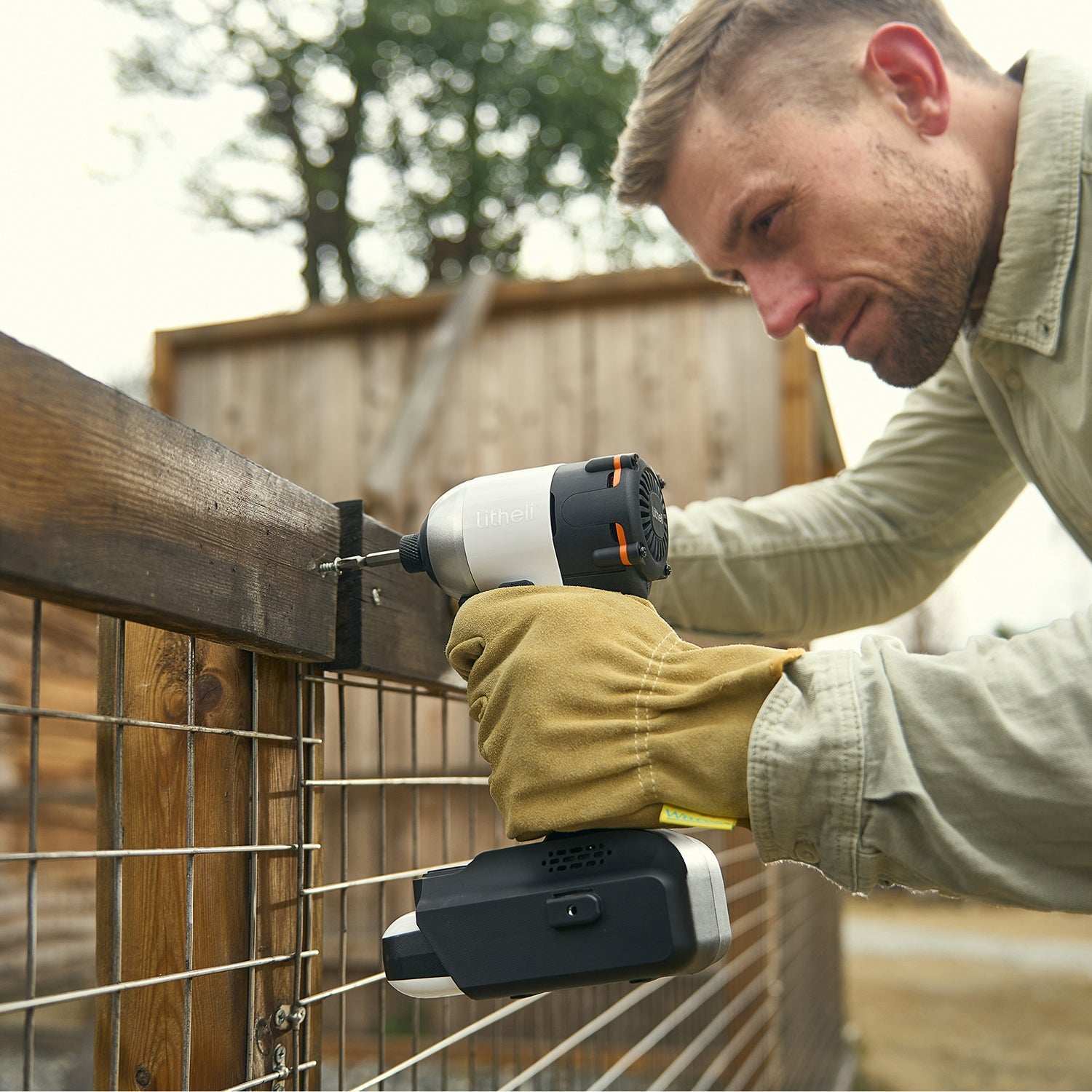 Professional Worker Using Litheli Cordless Brushless Drill and Impact Driver on Jobsite