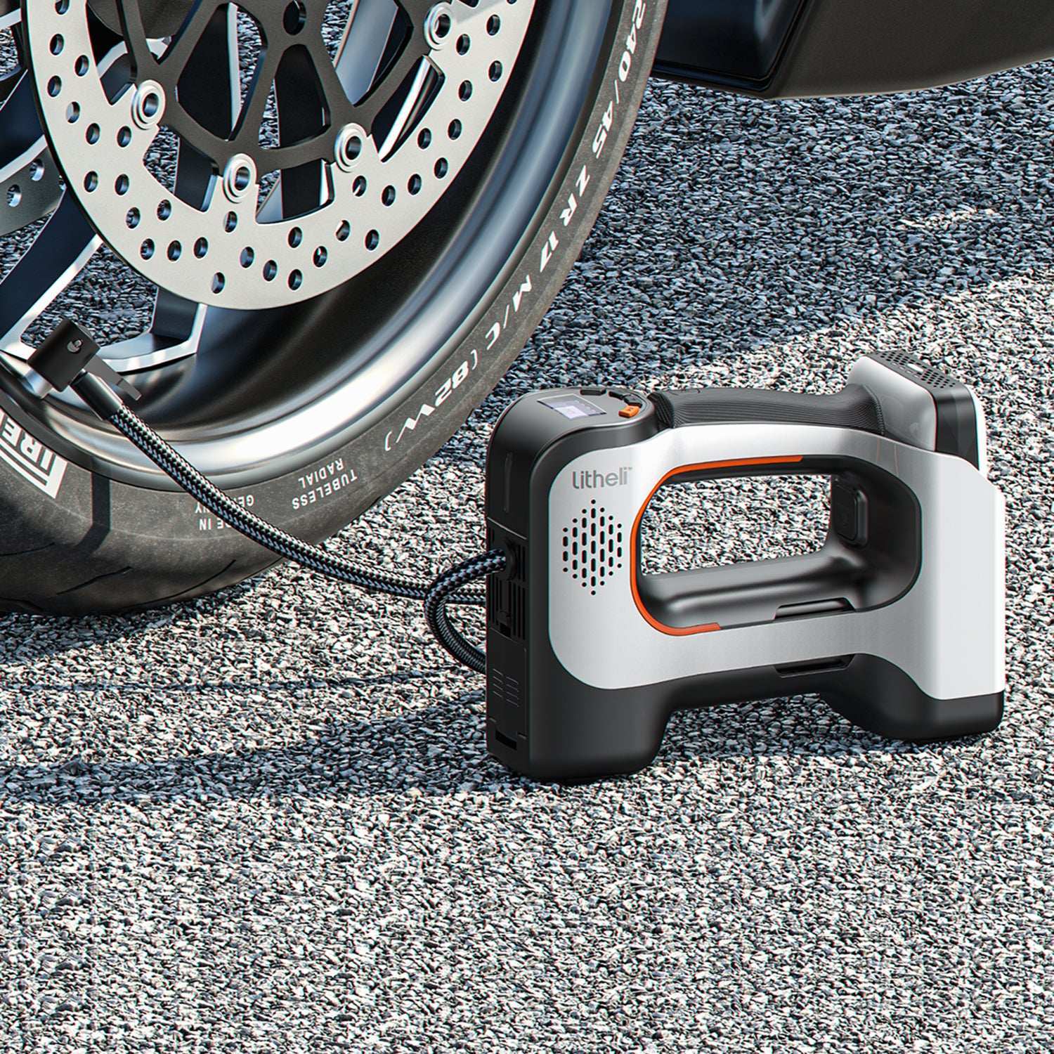 Cordless tire inflator pumping car tire on the road, portable air compressor for emergency use
